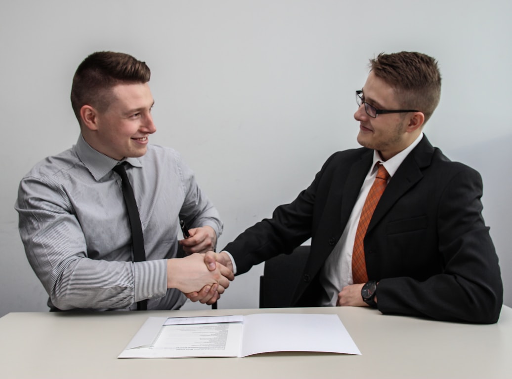 Two business partners shaking hands